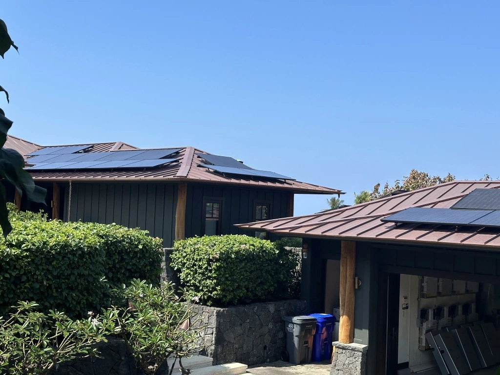 Modern house with rooftop solar panels integrated into the roof design for efficient energy generation.