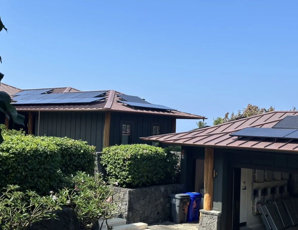 Modern house with rooftop solar panels integrated into the roof design for efficient energy generation.